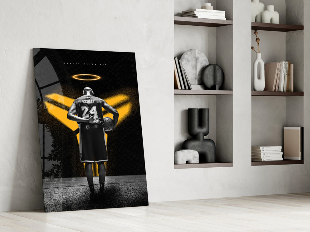 Basketball-legend artwork anchoring a wall with gold-and-onyx palette