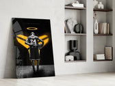 Basketball-legend artwork anchoring a wall with gold-and-onyx palette