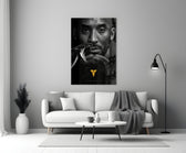 Kobe Bryant glass wall art styled above a console in a media room