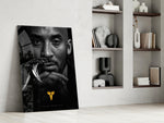 Basketball-legend artwork anchoring a wall with gold-and-monochrome palette