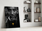 Basketball-legend artwork anchoring a wall with gold-and-monochrome palette