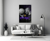 Kobe Bryant glass wall art styled above a console in a home gym