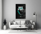 Black Kaws glass wall art styled above a sideboard in a media room