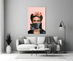 Contemporary Kahlo glass wall art styled above a console in a powder room