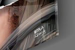 Contemporary Mona Lisa panel catching window light to reveal its cinematic glow