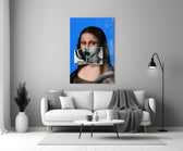 Contemporary Mona Lisa glass wall art styled above a console in a powder room