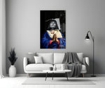 Contemporary Virgin glass wall art styled above a console in a study