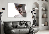 Female Portrait 34 glass wall art styled above a bed in a metallic-accent bedroom