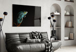 Chameleon glass wall art styled above a desk in an explorer-taste study