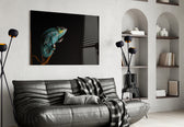 Chameleon glass wall art styled above a desk in an explorer-taste study