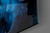 Blue Smoke artwork anchoring a hallway with cool palette