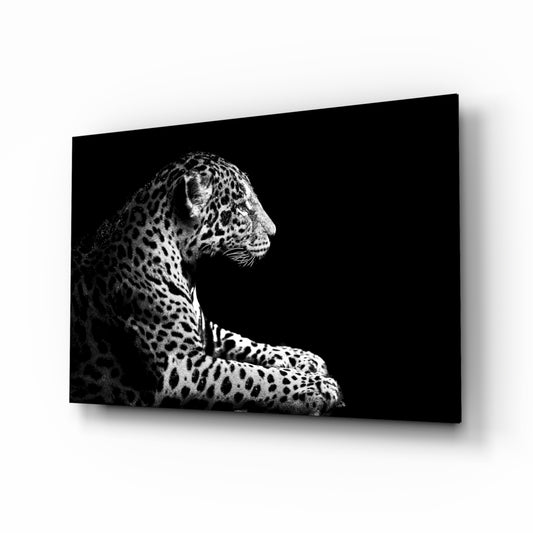 Leopard glass wall art displayed above a console in a designer interior
