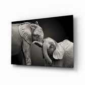 Elephants glass wall art displayed above a console in a designer interior