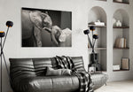 Elephants glass wall art styled above a bed in an affectionate-mood bedroom