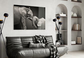 Elephants glass wall art styled above a bed in an affectionate-mood bedroom