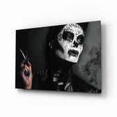 Women's glass wall art displayed above a console in a designer interior