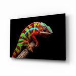 Chameleon glass wall art displayed above a console in a designer interior