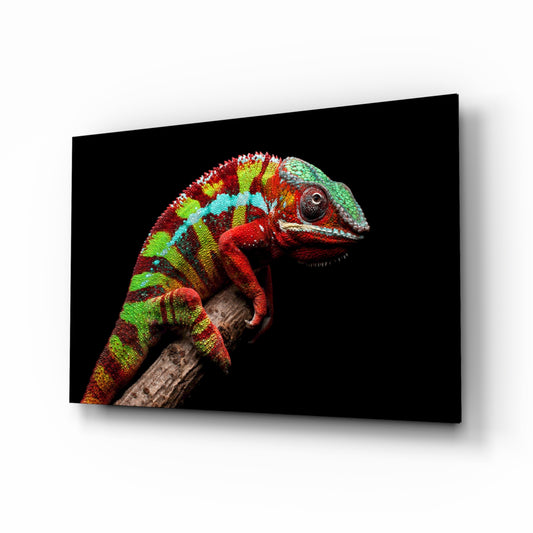 Chameleon glass wall art displayed above a console in a designer interior