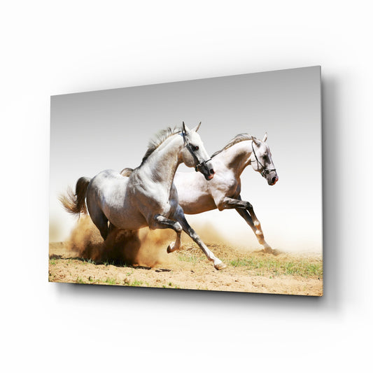 Running Horses glass wall art displayed above a console in a designer interior