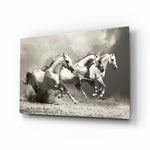 Running Horses glass wall art displayed above a console in a designer interior
