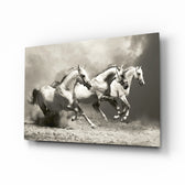 Running Horses glass wall art displayed above a console in a designer interior