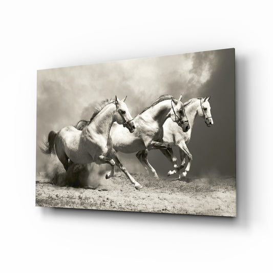 Running Horses glass wall art displayed above a console in a designer interior