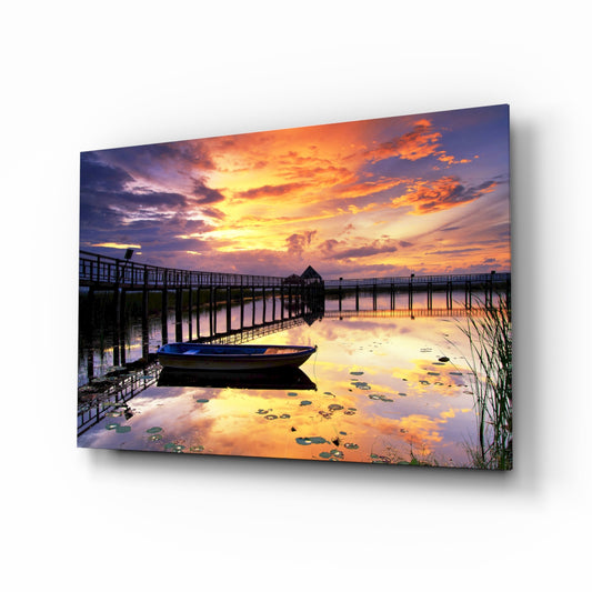 Sunset on the Dock glass wall art displayed above a console in a designer interior