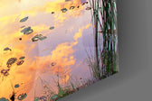 Sunset on the Dock artwork anchoring a lakeside-themed wall in warm palette