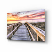 Sunset on the Dock glass wall art displayed above a console in a designer interior