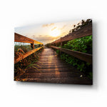 Sunset on the Beach glass wall art displayed above a console in a designer interior