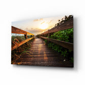 Sunset on the Beach glass wall art displayed above a console in a designer interior