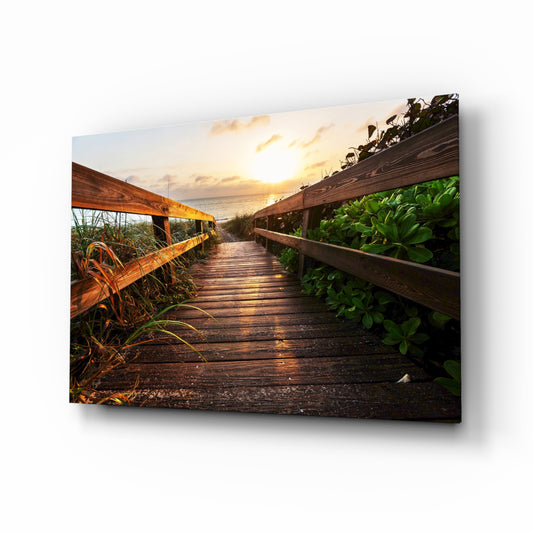 Sunset on the Beach glass wall art displayed above a console in a designer interior