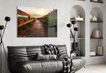 Sunset on the Beach glass wall art styled above a sofa in a seaside-mood living room
