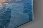 Boat artwork anchoring a coastal-themed wall in warm palette