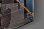 Sunset on the Beach artwork anchoring a coastal-themed wall in dramatic palette