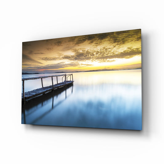Sunset on the Beach glass wall art displayed above a console in a designer interior