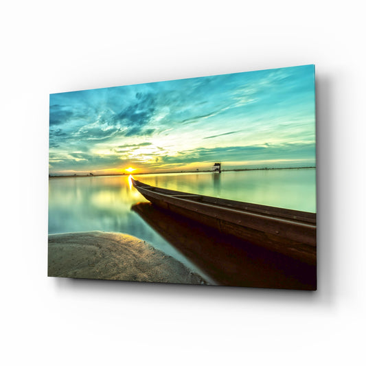 Kayak on the Beach and Sunset glass wall art displayed above a console in a designer interior