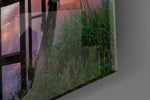 Sunset on the Beach artwork anchoring a contemporary wall in dramatic palette