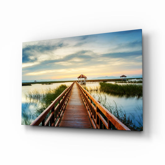 Long Dock on the Lake glass wall art displayed above a console in a designer interior