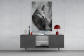 Cat panel catching soft light to reveal its green gaze