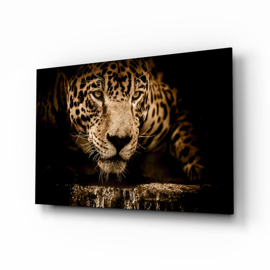 Leopard glass wall art displayed above a console in a designer interior