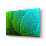 Green Leaf glass wall art displayed above a console in a designer interior