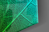 Green Leaf artwork anchoring a biophilic-themed wall in jewel-tone palette