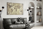 World Map glass wall art styled above a desk in a travel-mood study