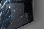 Cosmos artwork anchoring a sci-fi-themed wall in moody palette