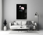 Close-up detail of the pink peony bloom and bud on dark ground