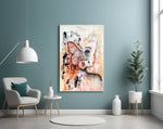 Abstract Woman glass wall art styled above a bed in a gentle-palette bedroom