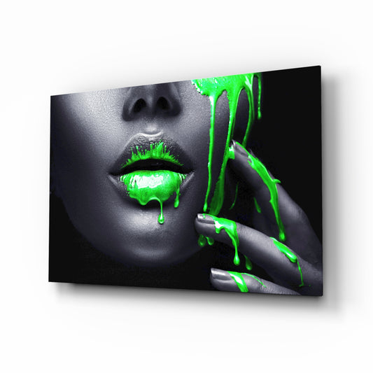 Women's glass wall art displayed above a console in a designer interior