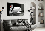 Swan glass wall art styled above a bed in a serene bedroom