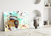 Close-up detail of yellow VW camper with turquoise watercolor splatter